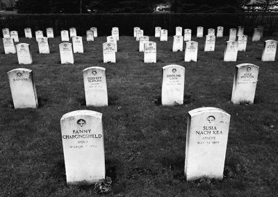 Black and white photograph of turn of the century graves at the Carlisle Indian School cemetery.