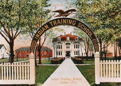 Colorzied photo of the entrance to the Chemewa Indian Training School in Salem, OR around 1900.